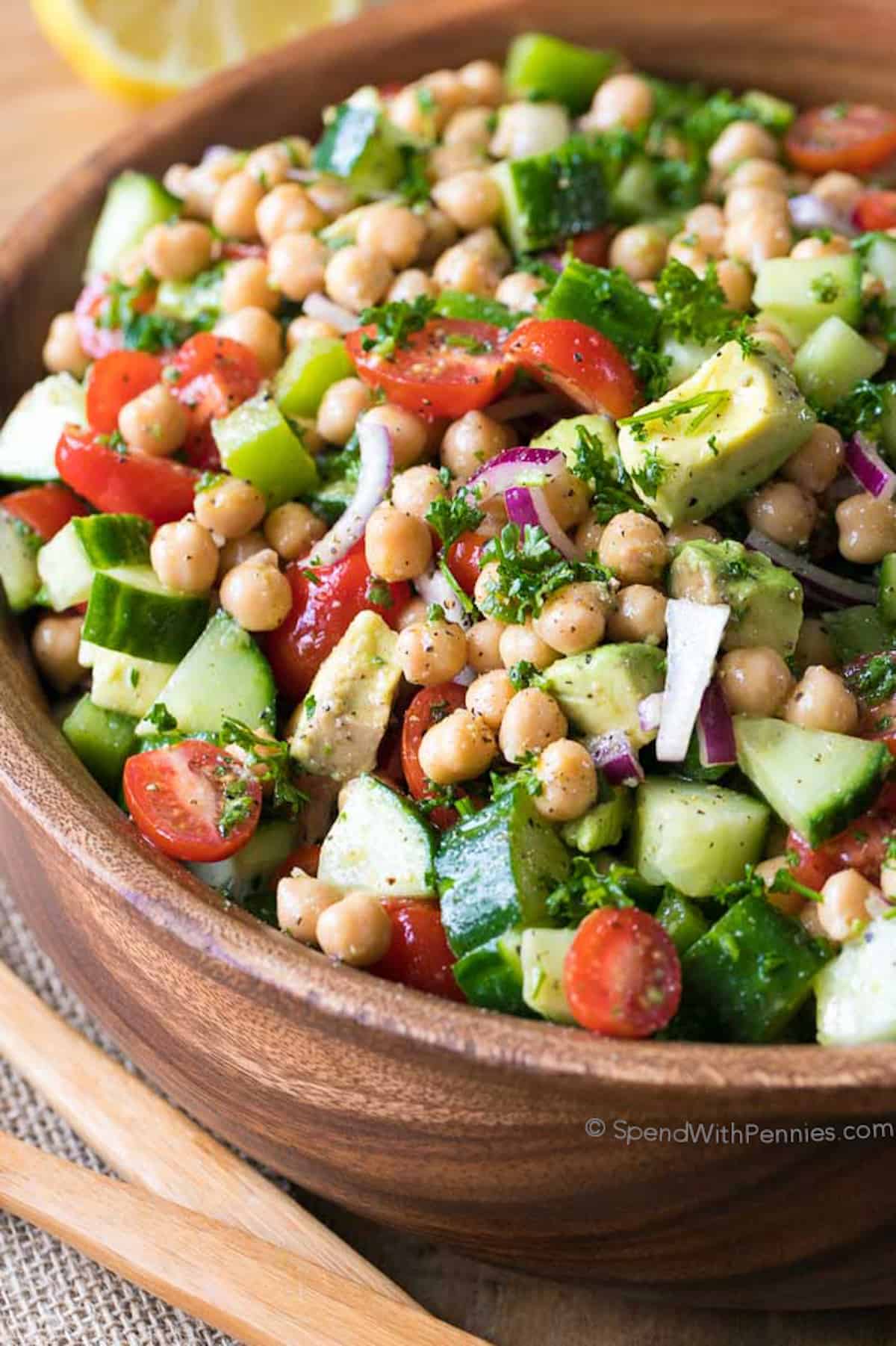 wood bowl filled with chickpea salad