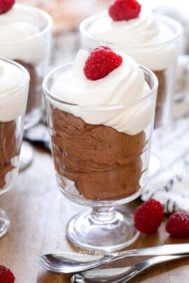Chocolate Mousse with whipped cream and a raspberry