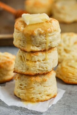 Buttermilk Biscuits in a pile with butter and honey