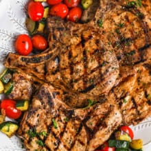 cooked Grilled Pork Chops with vegetables on a plate