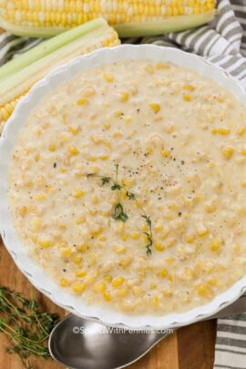 a bowl of creamed corn with fresh herbs