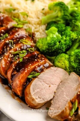 Teriyaki Pork Tenderloin on a plate with broccoli and rice