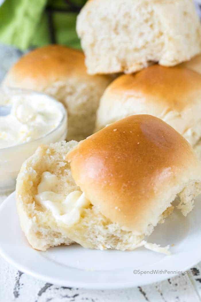 dinner roll on plate with butter