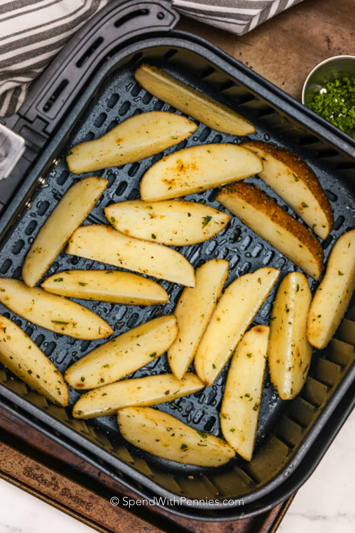 Air Fryer Potato Wedges uncooked in an air fryer basket