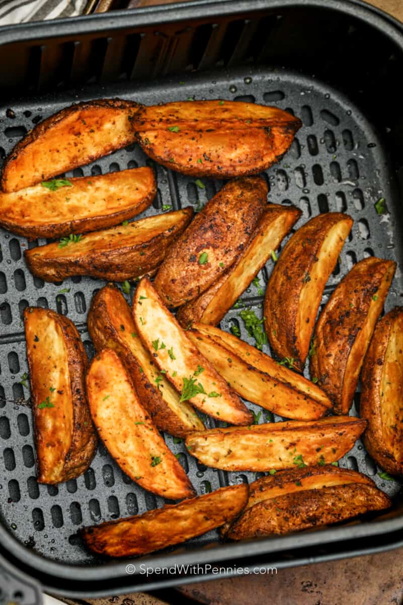 Air Fryer Potato Wedges cooked in an air fryer basket
