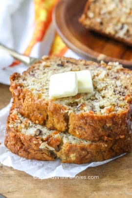 Slices of carrot banana bread with squares of butter