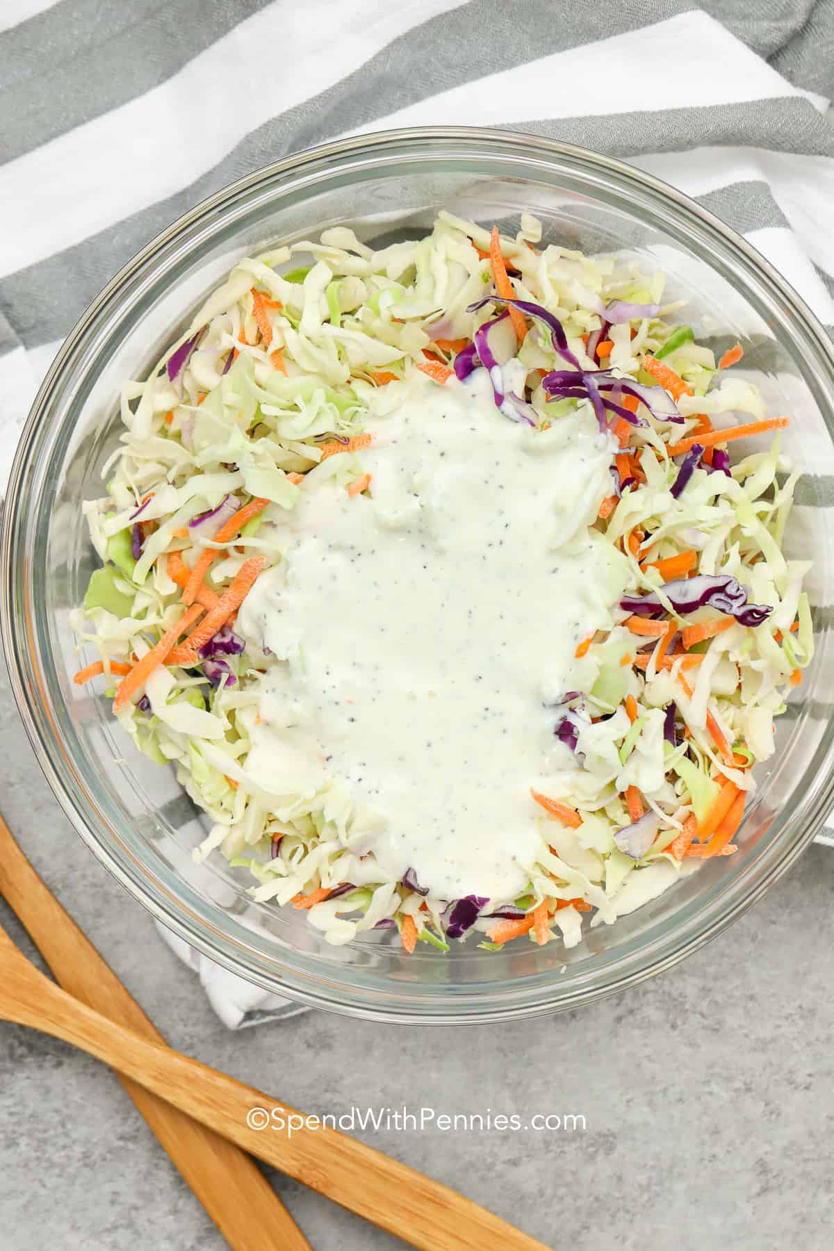 Overhead shot of Coleslaw with coleslaw dressing on top ready to mix