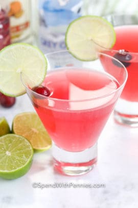 Cosmopolitans in glasses garnished with lime