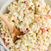 serving macaroni salad with a spoon