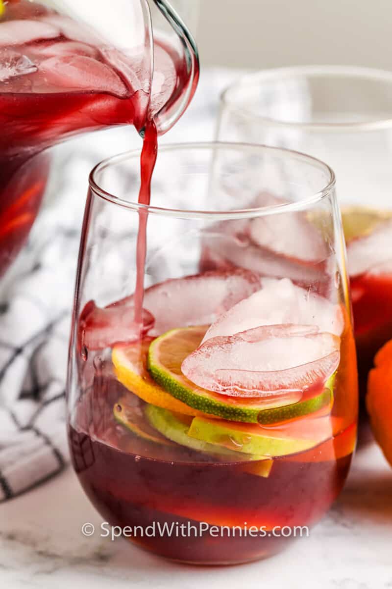 pouring Easy Red Sangria in glass