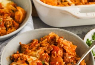 Cabbage Roll Casserole in a bowl with dish full in the back