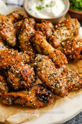 Everything Air Fryer Wings on a plate with dip