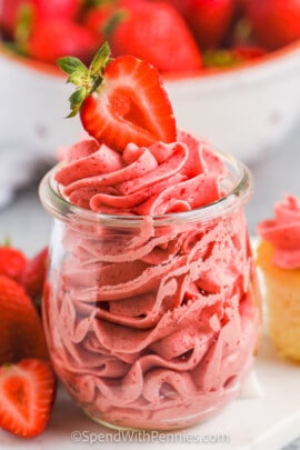 Fresh Strawberry Buttercream in a glass with a strawberry on top