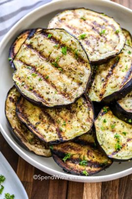 stack of Grilled eggplant on a white plate