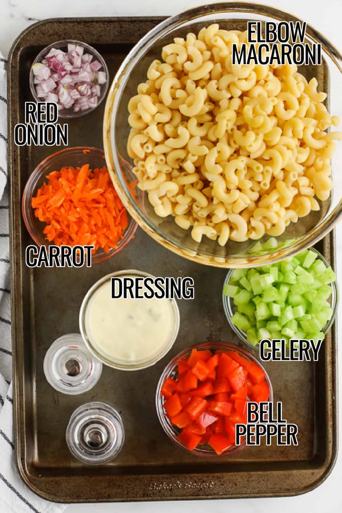 Ingredients for Creamy Macaroni Salad on a pan