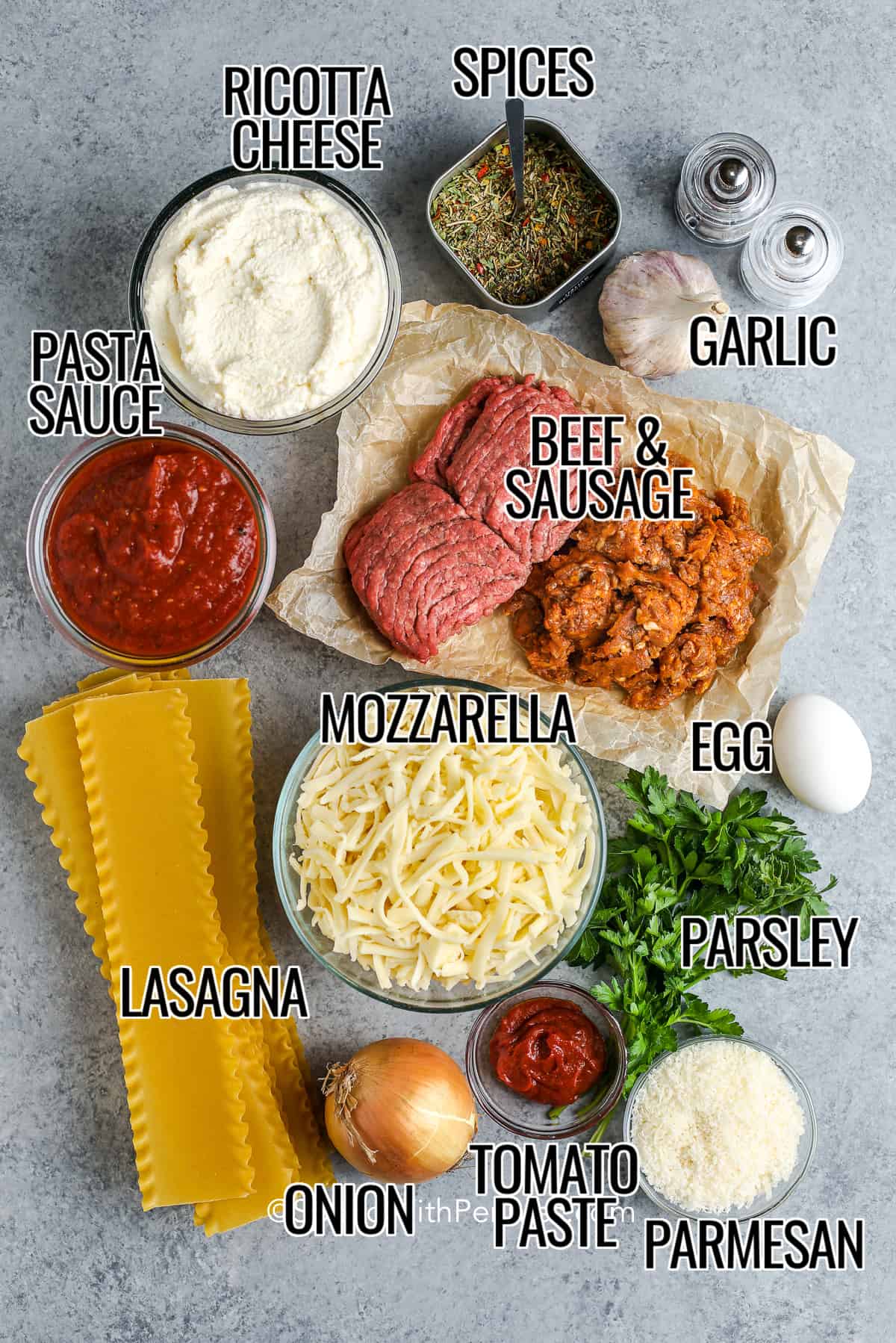ingredients for lasagna on a wood board
