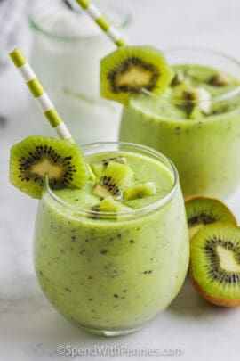 Kiwi Smoothie in a glass with pieces of kiwi as garnish