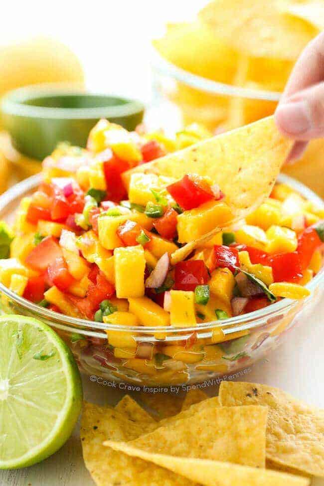 mango salsa in glass bowl with chip