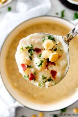 New England Clam Chowder in a ladle
