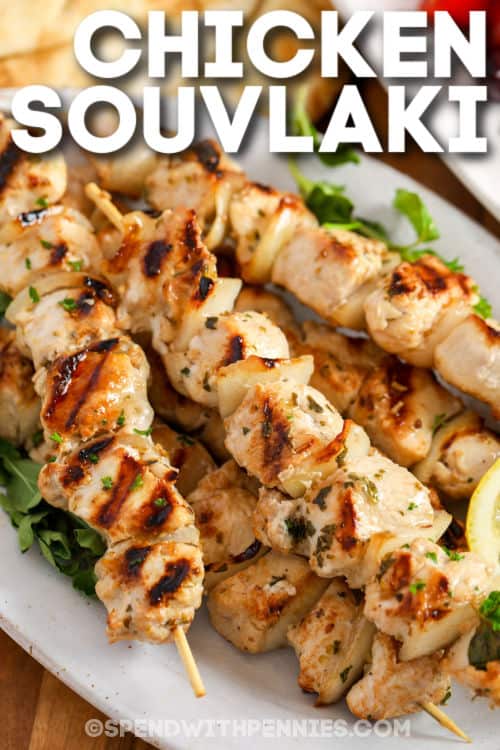close up of Chicken Souvlaki on a plate with writing