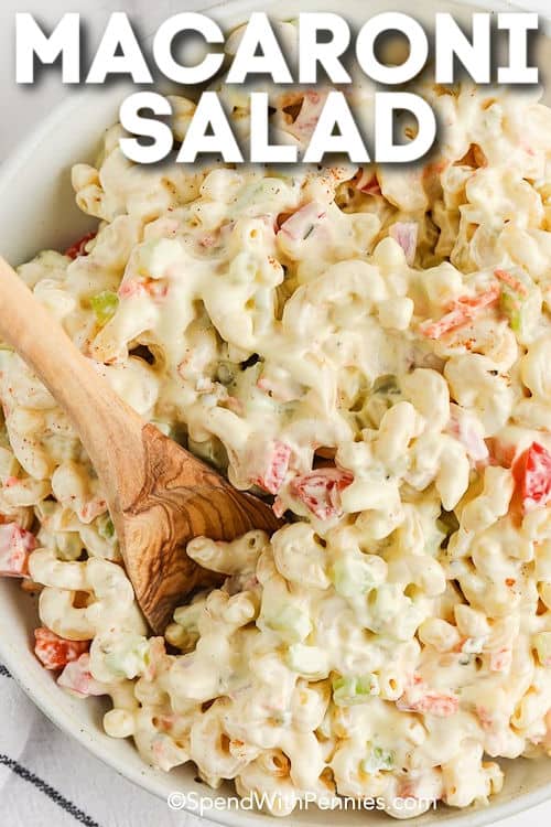 bowl of Creamy Macaroni Salad with a wooden spoon and title