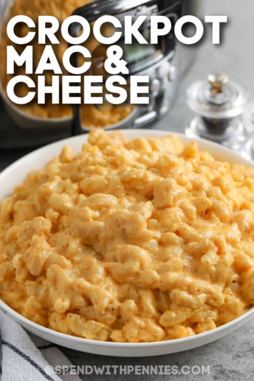 A serving dish of Crock Pot Mac & Cheese with text