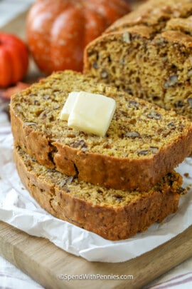 two slices of pumpkin bread with butter