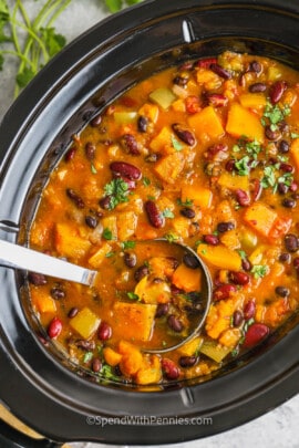 Slow Cooker Butternut Squash Chili in a slow cooker with a ladle