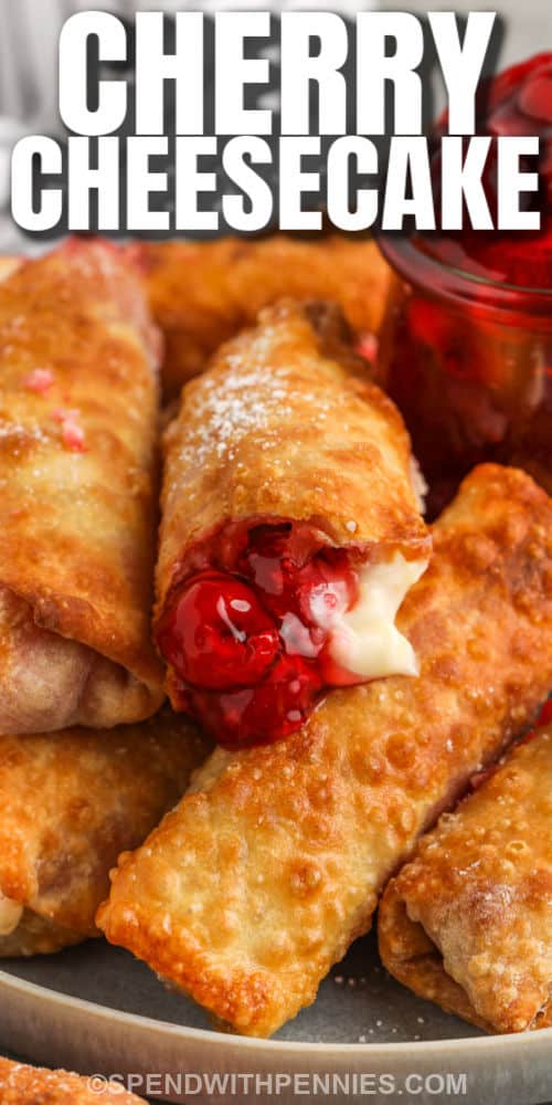 close up of Cherry Cheesecake Egg Rolls on a plate with a title