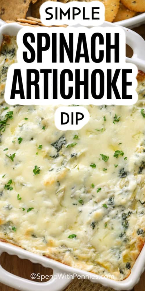 close up of cooked The Best Spinach Artichoke Dip in the dish with writing