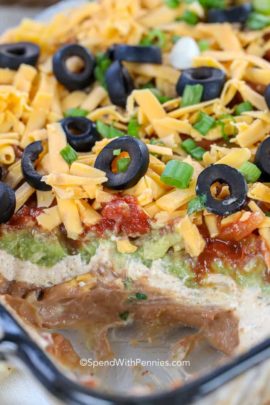 7 Layer Dip in a dish with some taken out