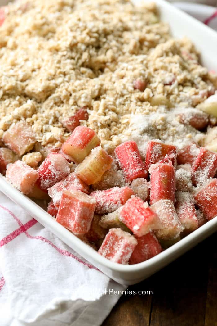 Rhubarb Crisp being prepared in a white baking dish