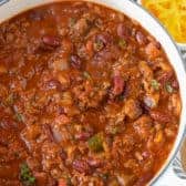 The Best Chili Recipe with side of cheese & chopped onion