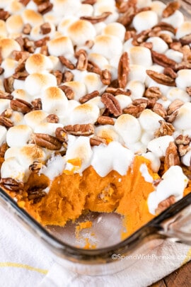 Sweet potato casserole in a dish with a serving scooped out